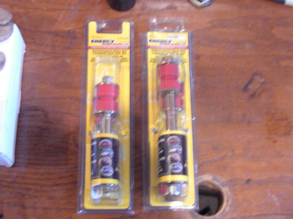 Two red and silver suspension bushings in yellow packaging
