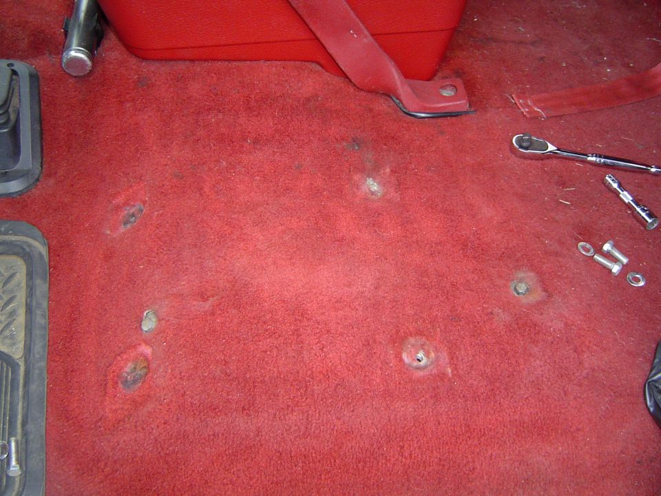 Took out the drivers seat, you can see the old bench seat mounts