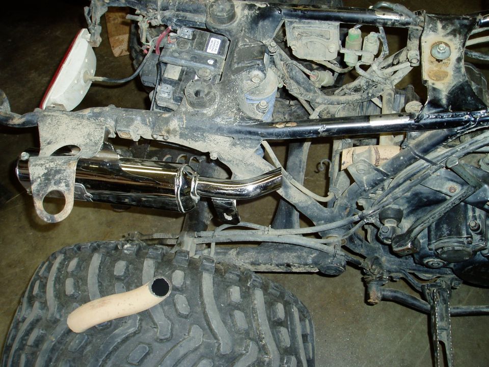 ATV exhaust pipe and rear tire