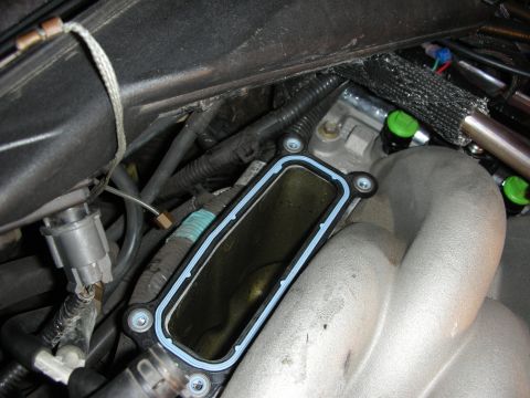 1992 Ford Crown Victoria - Close-up of an engine intake manifold gasket during a repair or rebuild.