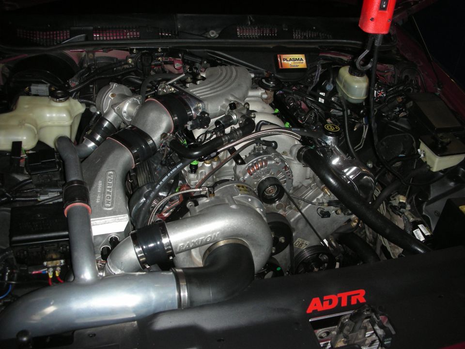 Engine bay with Paxton and Vortech superchargers, ADTR branding visible