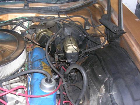 1975 Ford Ranchero - Close-up view of the engine bay, showing the air cleaner, brake booster, and master cylinder components.