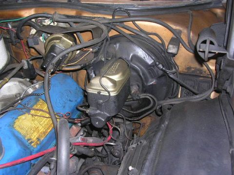 1975 Ford Ranchero - Close-up of the engine bay, focusing on the brake system components and associated wiring.