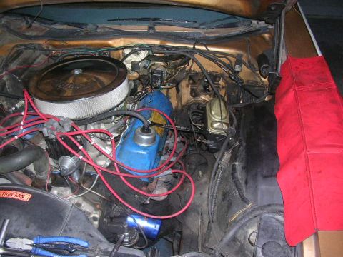 1975 Ford Ranchero - Close-up view of a vehicle's engine bay, showing various components and wiring.