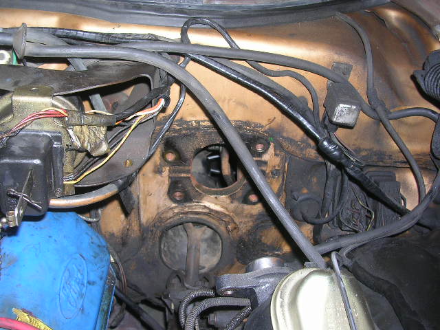 Engine bay wiring harness and brake fluid reservoir with Supermotors.net watermark