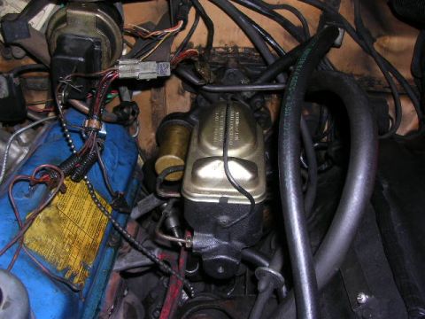 1975 Ford Ranchero - Close-up of engine bay components including brake master cylinder and various hoses.