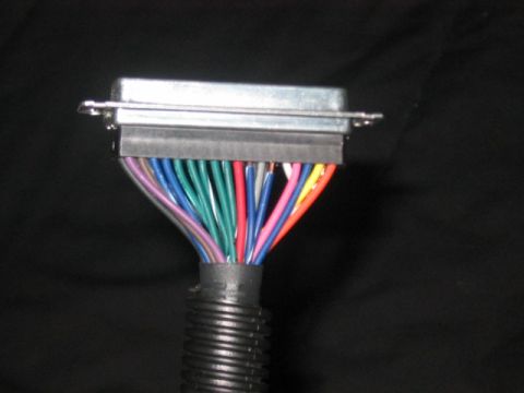 1991 Ford Bronco - A close-up view of a multi-pin electrical connector with many colored wires.