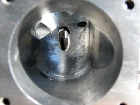 2003 Ford Crown Victoria - This is a close-up view of the inside of an engine cylinder, revealing the bore and valve openings.
