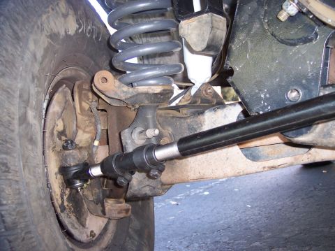 1996 Ford Bronco - Detailed view of the front suspension and steering system of an unidentified vehicle.