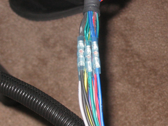 Wiring harness with multiple crimped connectors and colored wires