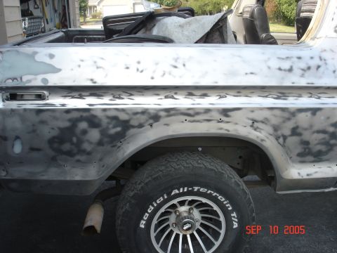 1979 Ford Bronco - Ford Bronco body undergoing prep work, with primer and body filler visible. Date stamp indicates Sep 10, 2005.