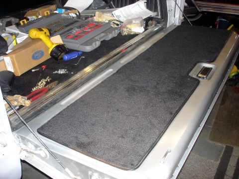 1979 Ford Bronco - The cargo area of a 1979 Ford Bronco is shown with tools and supplies, suggesting ongoing maintenance or customization.