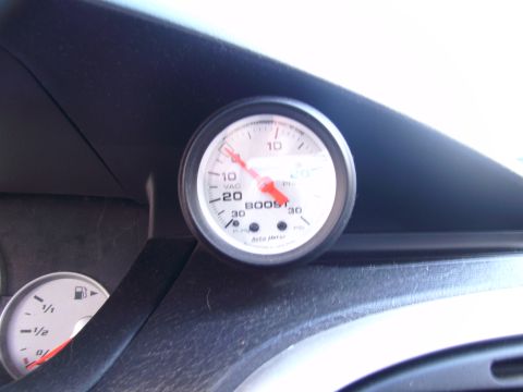 1996 Ford Probe - Interior view of dashboard gauges, including a boost gauge and fuel gauge.