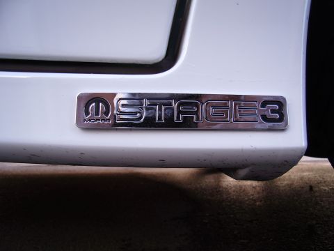 1996 Ford Probe - Close-up of a Mopar Stage 3 badge affixed to a white vehicle's exterior.