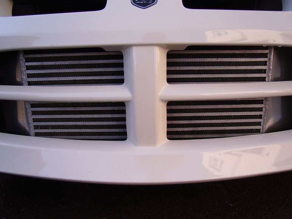 White car front grille with dual intercoolers visible