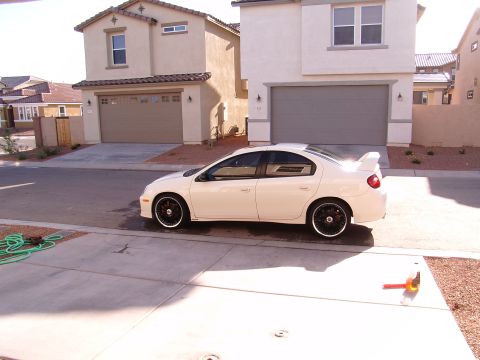 1996 Ford Probe - Side view of a white Dodge Neon SRT-4 with a rear spoiler and custom wheels.