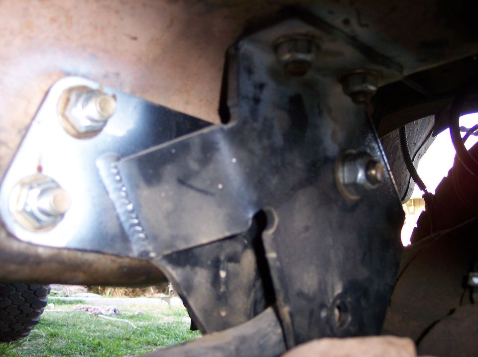 Frame bracket with bolts and welds