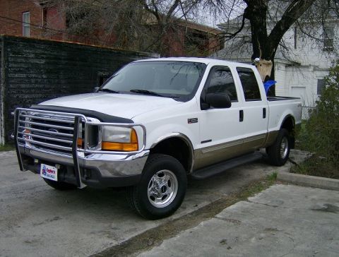 2000 Ford F-250 - This Ford F-250 Super Duty pickup truck is seen from a three-quarter front angle, parked outdoors.