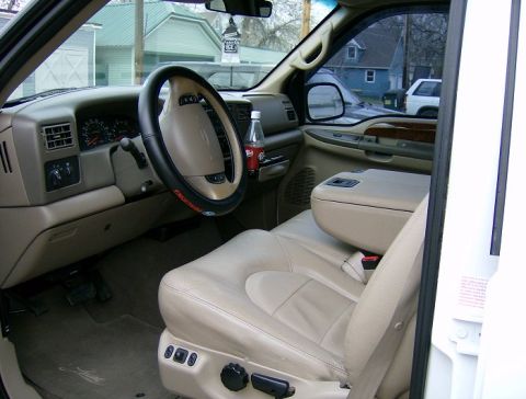 2000 Ford F-250 - Interior view of a 2000 Ford F-250, highlighting the tan leather seats and dashboard.