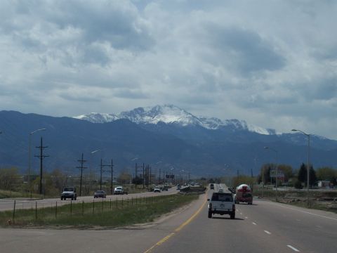 1972 Ford Ranchero - Vehicles travel on a highway with a mountain range visible in the background.