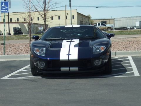 1972 Ford Ranchero - This modern sports car, likely a Ford GT, is parked in a handicapped space, contradicting the registry's claim of a 1972 Ford Ranchero.