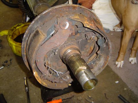 1978 Ford Bronco - A heavily rusted brake drum assembly is shown, with internal components exposed and showing signs of wear and tear.