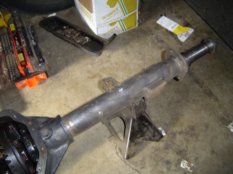 1978 Ford Bronco - Dana 70 FF axle assembly, likely removed from a truck or SUV, resting on jack stands.