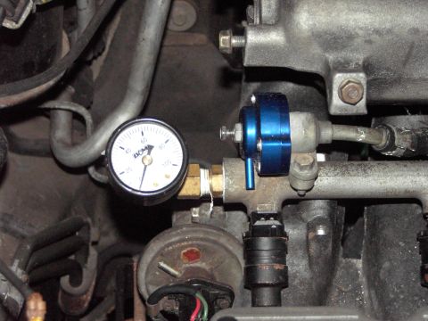 1989 Ford Probe - Fuel pressure regulator and gauge installation on an engine.