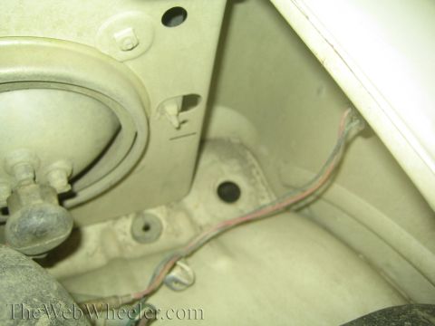1987 Suzuki Samurai - Detail shot of the inner fender well, revealing wiring and structural components.
