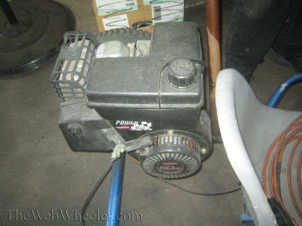 Black Power-Seal engine with a 5.0 HP rating on a blue frame