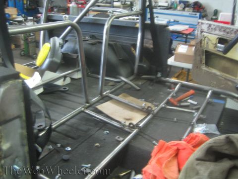 1987 Suzuki Samurai - Roll cage fabrication in progress inside a vehicle's interior.