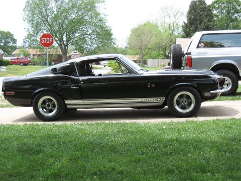 1968 Shelby GT500 - Side view of a black 1968 Shelby GT500KR with G.T.500KR side stripe.