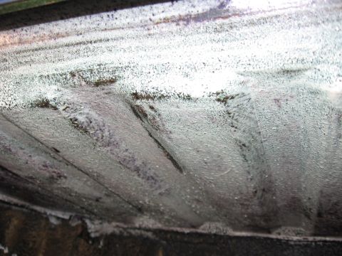 1973 Ford Ranchero - Close-up view of the textured undercarriage of a vehicle, possibly showing rust or protective coating.