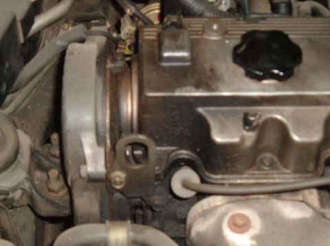 1989 Mazda MX-6 - Engine components visible in the photograph, likely from a car's engine bay.
