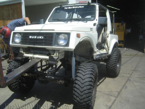 1987 Suzuki Samurai - A 1987 Suzuki Samurai is shown with its suspension modified for off-road use.