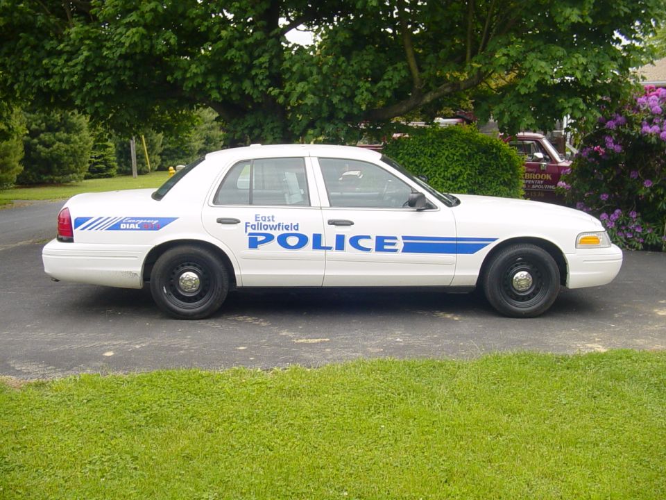 White Ford Crown Victoria police car with East Fallowfield Police door markings