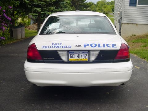2002 Ford Crown Victoria - This 2002 Ford Crown Victoria police car is parked in a driveway.