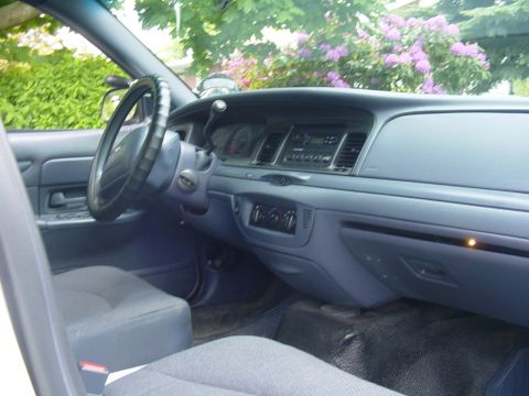 2002 Ford Crown Victoria - Interior view of a 2002 Ford Crown Victoria, showing the dashboard and steering wheel.