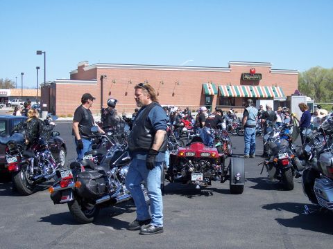 1972 Ford Ranchero - A gathering of motorcycles and a red trike in a parking lot.