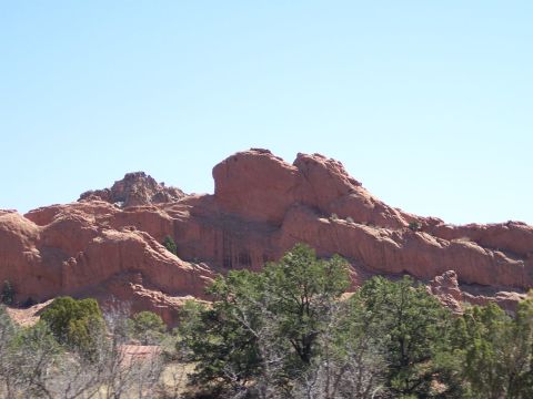 1972 Ford Ranchero - Natural landscape striking red rock formations and scattered trees under a bright blue sky.