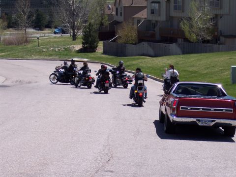 1972 Ford Ranchero - A group of motorcycles follows a 1972 Ford Ranchero on a paved road.