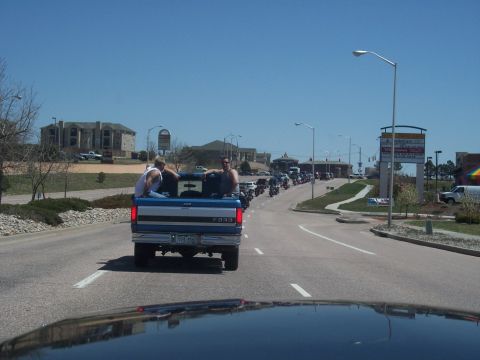 1972 Ford Ranchero - A blue Ford pickup truck leads a procession of motorcycles on a sunny day.