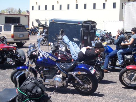 1972 Ford Ranchero - Motorcycles are parked together, with people interacting around them.