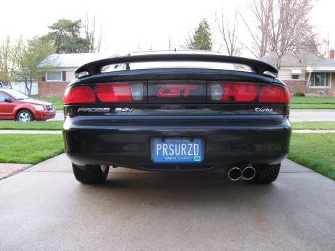 1995 Ford Probe - Rear view of a black 1995 Ford Probe GT Turbo, dual exhaust and a custom Michigan license plate.