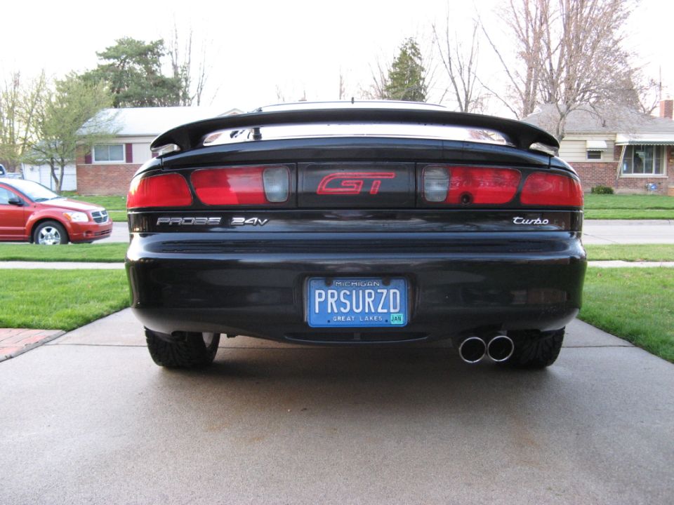 Black 1995 Ford Probe GT Turbo rear view with custom plate