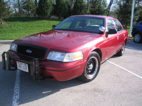 2001 Ford Crown Victoria - This 2001 Ford Crown Victoria, equipped with a push bar, is seen from a three-quarter front view.