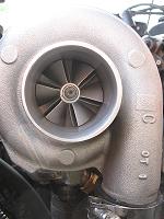 1996 Ford Probe - Close-up of a turbocharger, identified by markings as a GT35 model, likely part of an engine rebuild.