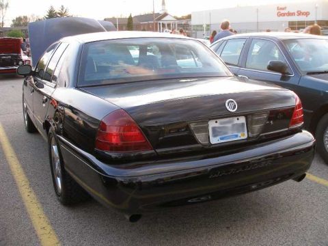 1998 Ford Crown Victoria - Rear view of a black Mercury Marauder sedan with 'Marauder' badging visible.