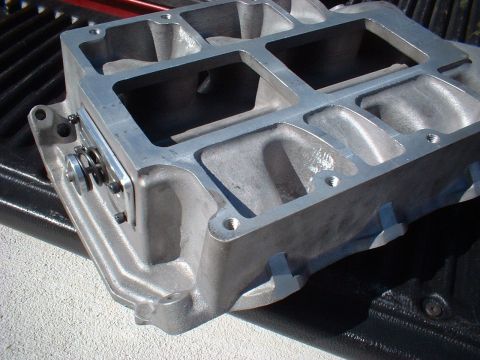 1964 Ford 427 - Close-up of an aluminum intake manifold, likely for a performance engine. The registry claims it's a 1964 Ford 427, but this is unconfirmed.