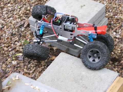 1996 Ford Bronco - A detailed view of a remote control rock crawler, showing its intricate mechanical components and off-road tires.